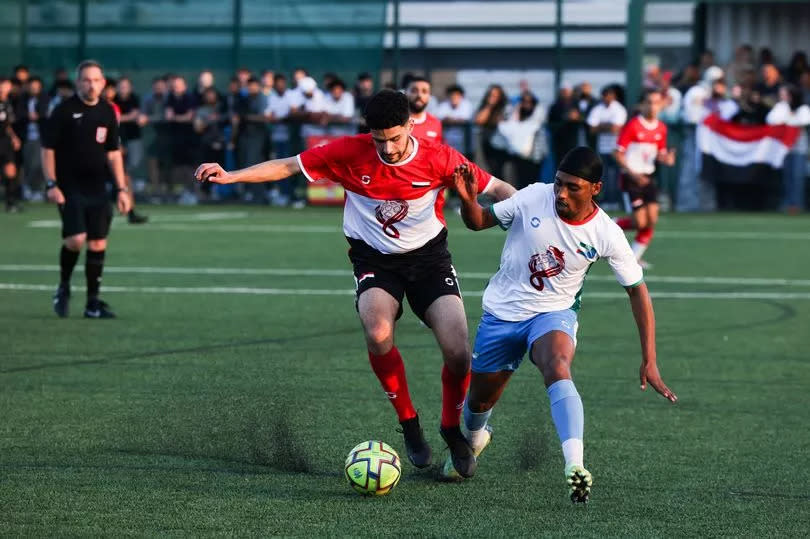 Action during the Yemen v Somali Team quarter finals at the World in One City last night at Jericho Lane in Aigburth as the opposing players tussle for the ball (Image: Liverpool ECHO)