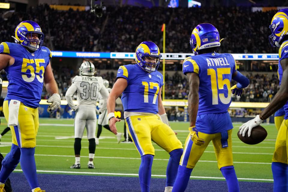 Los Angeles Rams quarterback Baker Mayfield (17) celebrates with teammates wide receiver Tutu Atwell (15) and center Brian Allen (55) after a touchdown by wide receiver Van Jefferson, right, during the second half of an NFL football game against the Las Vegas Raiders, Thursday, Dec. 8, 2022, in Inglewood, Calif. (AP Photo/Marcio Jose Sanchez)
