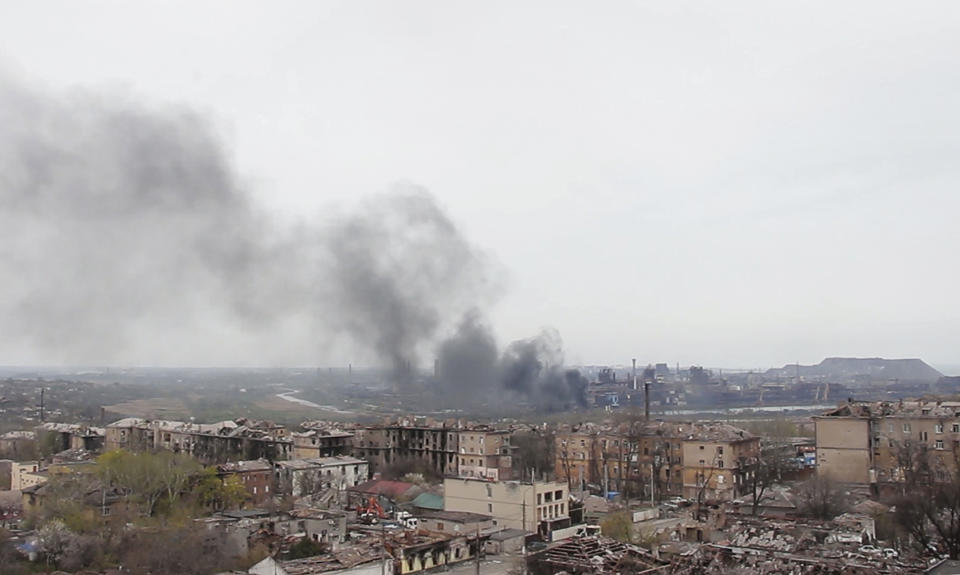 In this photo taken from video, smoke rises from the Metallurgical Combine Azovstal in Mariupol, in territory under the government of the Donetsk People's Republic, eastern Ukraine, Tuesday, May 3, 2022. (AP Photo)