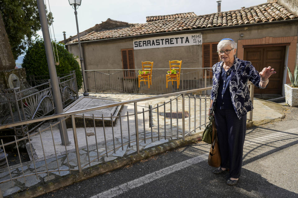 Rabbi Barbara Aiello walks in Serrastretta, southern Italy, Friday, July 8, 2022. From a rustic, tiny synagogue she fashioned from her family's ancestral home in this mountain village, American rabbi Aiello is keeping a promise made to her Italian-born father: to reconnect people in this southern region of Calabria to their Jewish roots, links nearly severed five centuries ago when the Inquisition forced Jews to convert to Christianity. (AP Photo/Andrew Medichini)