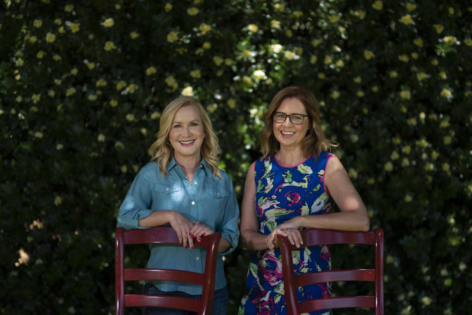 Angela Kinsey, left, and Jenna Fischer, friends and former co-stars of the comedy series "The Office" pose for photos in Glendale, Calif., Tuesday, March 22, 2022, to promote their book "The Office BFFs: Tales of The Office from Two Best Friends Who Were There." (AP Photo/Jae C. Hong)