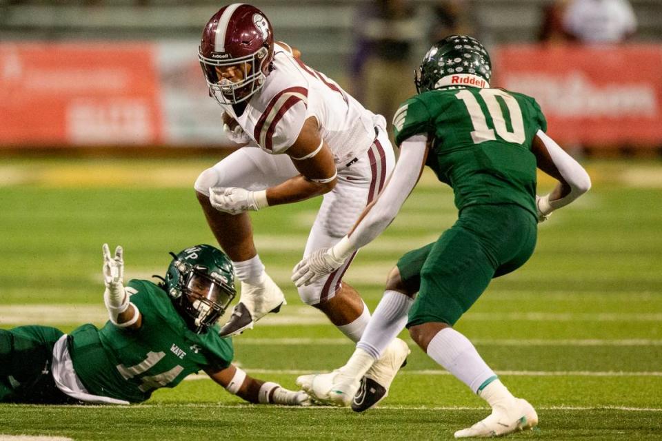 Picayune’s Dante Dowdell escapes tackle during the 5A State Championship at M.M. Roberts Stadium in Hattiesburg on Friday, Dec. 2, 2022.