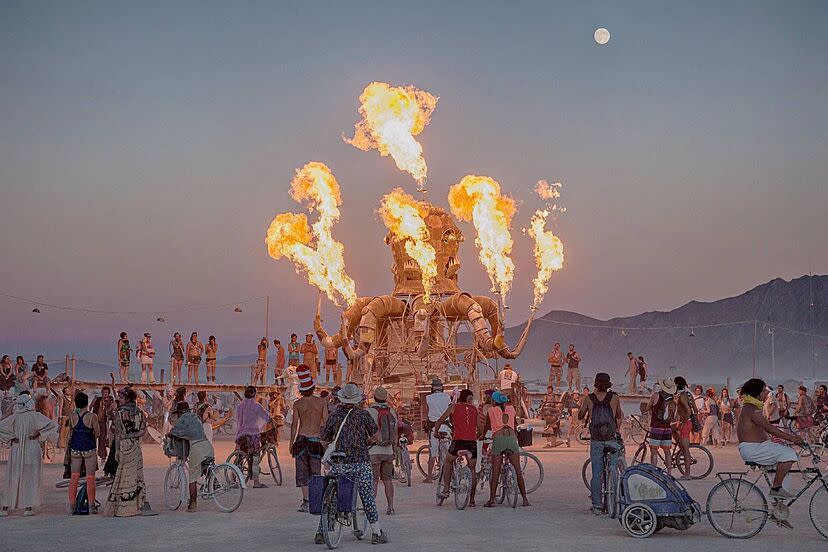 Burners gather under the full moon to witness a mesmerizing fire-breathing installation. 