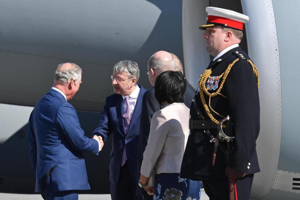 Prince Charles is greeted by George Ciamba, state secretary in the Foreign Ministry. (EPA)