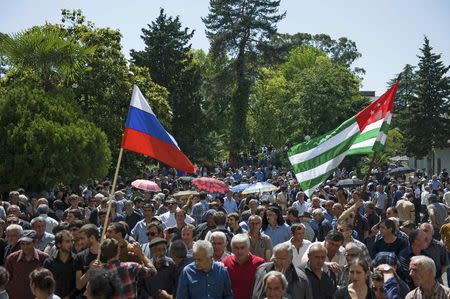 Opposition protesters gather outside the presidential headquarters in Sukhumi, the capital of Georgia's breakaway region of Abkhazia, in this May 28, 2014 file picture. REUTERS/Nina Zotina/Files