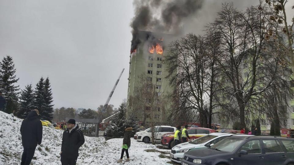 A fire burns as a gas explosion severely damaged a 12th storey apartment building in Presov, Slovakia, Friday, Dec. 6, 2019. The firefighters said the explosion occurred between the ninth and 12th storey and witnesses told them several people have escaped to the roof. Authorities didn't immediately confirm any injuries or fatalities. (AP Photo/Police of Slovakia/HO)