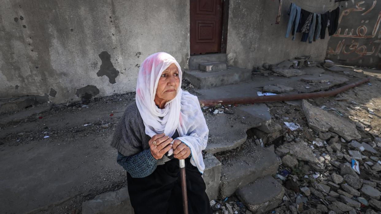 PHOTO: An elderly Palestinian woman looks on as she stops by debris in the Rafah refugee camp in the southern Gaza Strip, Mar. 21, 2024. (Mohammed Abed/AFP via Getty Images)