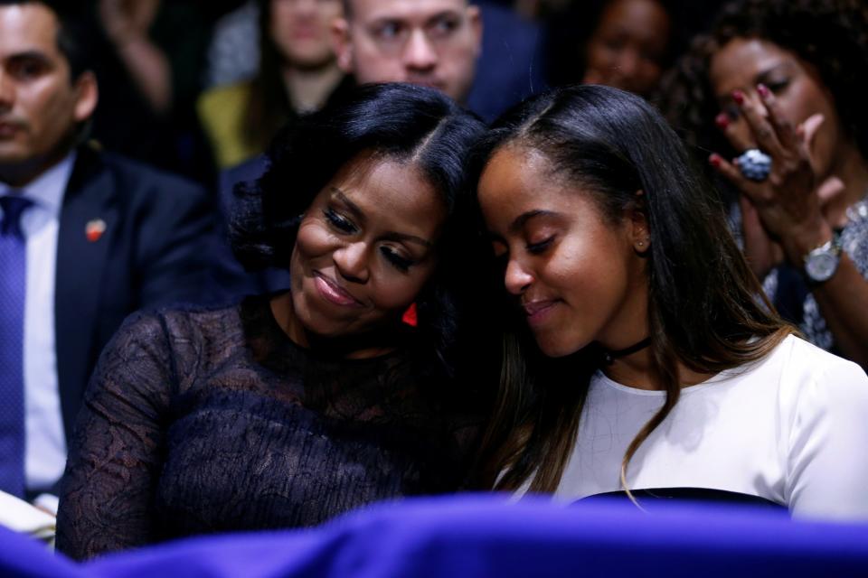 U.S. first lady Michelle Obama and her daughter Malia embrace as President Barack Obama praises them during his farewell address in Chicago, Illinois, U.S. January 10, 2017. (Photo: Jonathan Ernst/Reuters)