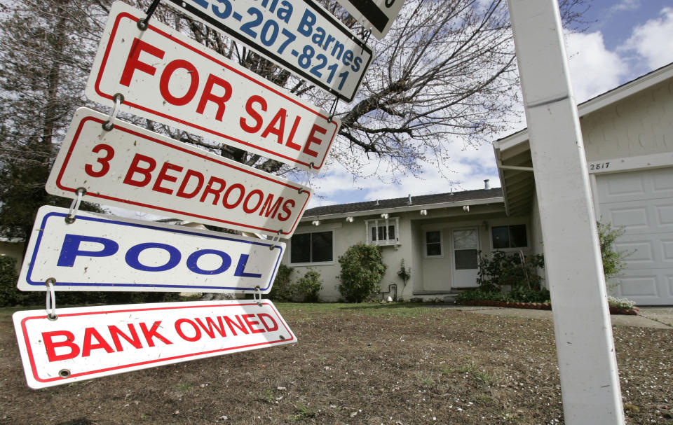 FILE - In this file photograph taken Feb. 23, 2009, a foreclosure sign blows in the wind in front of a home under foreclosure in Antioch, Calif. More than 1.5 million older Americans already have lost their homes, with millions more at risk as the national housing crisis takes its toll on those who are among the worst positioned to weather the storm, a new AARP report says. Older African Americans and Hispanics are the hardest hit. 