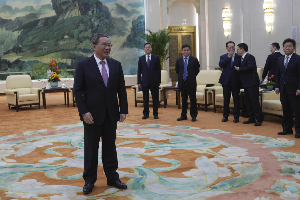 Chinese Premier Li Qiang, left, waits for the arrival of U.S. Treasury Secretary Janet Yellen, unseen for a meeting at the Great Hall of the People in Beijing, China, Sunday, April 7, 2024. Yellen, who arrived later in Beijing after starting her five-day visit in one of China's major industrial and export hubs, said the talks would create a structure to hear each other's views and try to address American concerns about manufacturing overcapacity in China. (AP Photo/Tatan Syuflana, Pool)