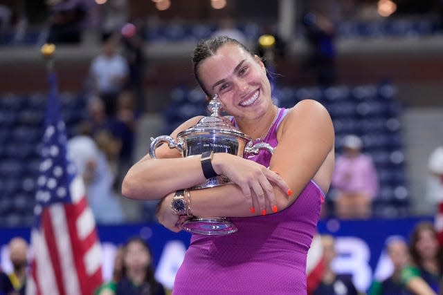 Aryna Sabalenka hugs the trophy after winning the women’s singles final at the US Open in New York