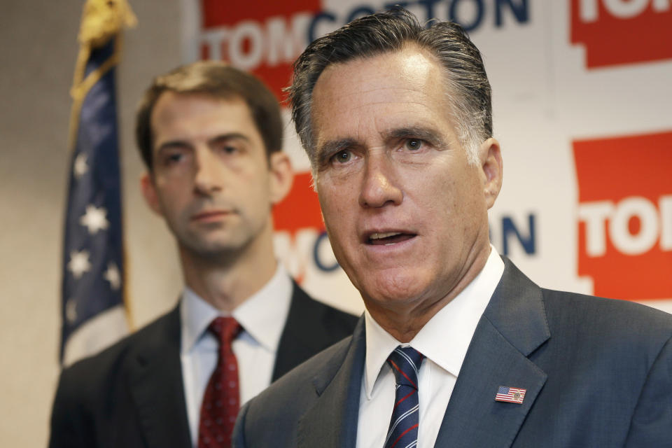 Former Republican Presidential candidate Mitt Romney, right, speaks at a  North Little Rock, Ark., news conference Thursday, Aug. 21, 2014, as he endorses U.S. Rep. Tom Cotton, R-Ark., left, in the race for U.S. Senate. (AP Photo/Danny Johnston)