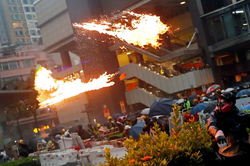 Pictures of the Year: Hong Kong protest tide turns into sea of flames