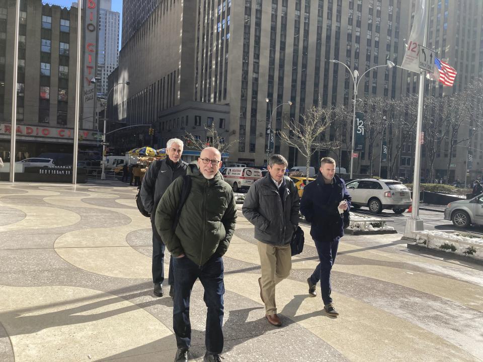 Bruce Meyer, chief negotiator, leads a players’ union bargaining team to negotiations at MLB offices Tuesday, Feb. 1, 2022, in New York. General counsel Ian Penny is at rear left, deputy general counsel Matt Nussbaum at center right and assistant general counsel Jeff Perconte is at far right. Talks to end the Major League Baseball lockout resume after a one-week break as the scheduled start of spring training in mid-February nears. (AP Photo/Ron Blum)