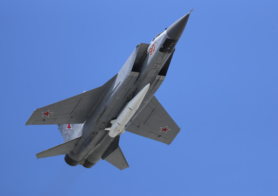 FILE - a Russian Air Force MiG-31K jet carries a high-precision hypersonic aero-ballistic missile Kh-47M2 Kinzhal during the Victory Day military parade to celebrate 73 years since the end of WWII and the defeat of Nazi Germany, in Moscow, Russia on Wednesday, May 9, 2018. The latest Russian missile barrage against Ukraine’s civilian infrastructure on Thursday, March 9, 2023 has marked one of the largest such attacks in months. Russia has used the Kinzhal missiles from the early days of the hostilities. (AP Photo, File)