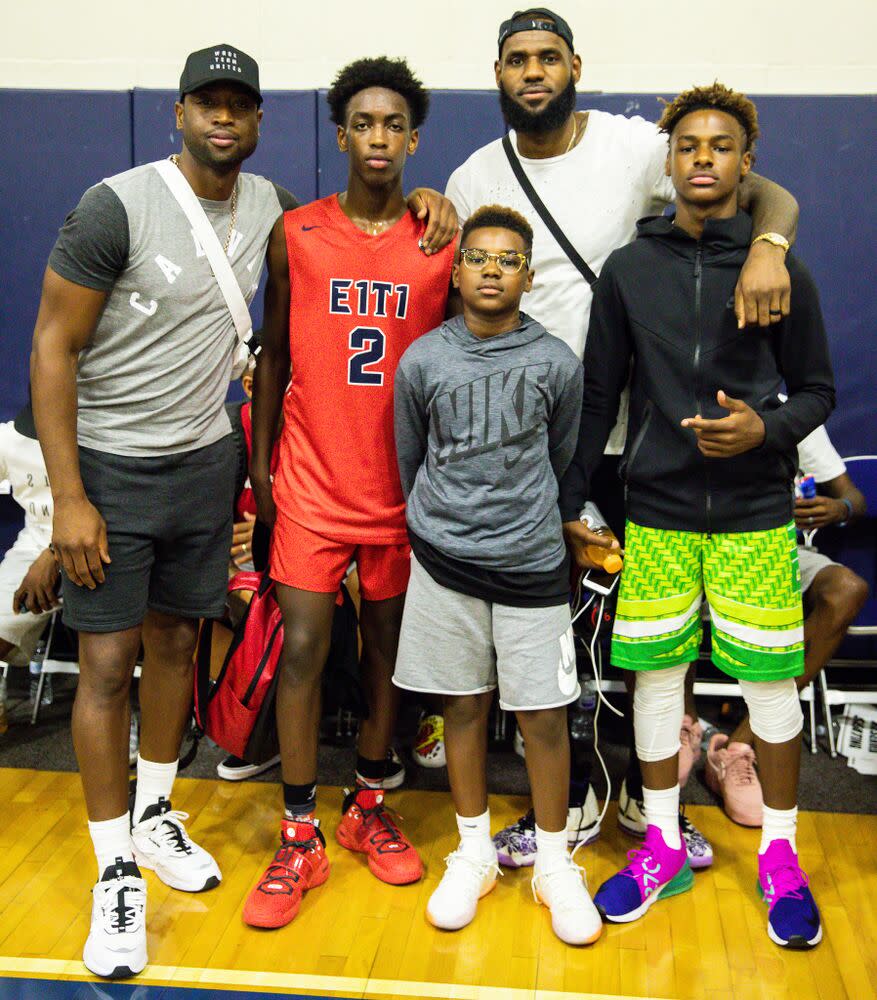 Dwyane Wade (L) and LeBron James with their sons (from L to R: Zaire, Bryce and Bronny) | Cassy Athena/Getty