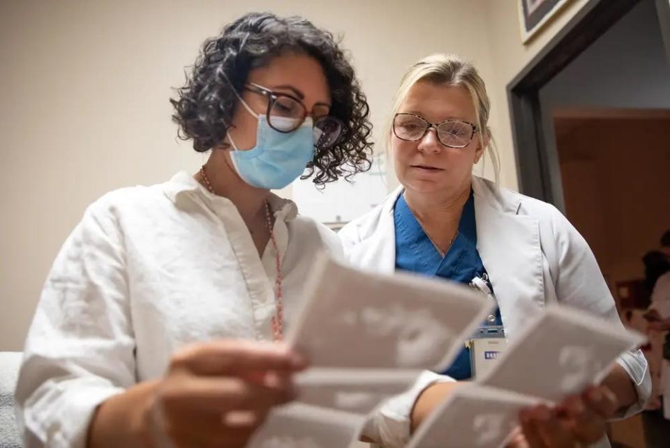 Dr. Amna Dermish, chief operating and medical services officer at Planned Parenthood of Greater Texas, and Melissa Lynn, a nurse practitioner at the Waco clinic, discuss ultrasounds at a Planned Parenthood clinic in Austin on Aug. 8, 2023.