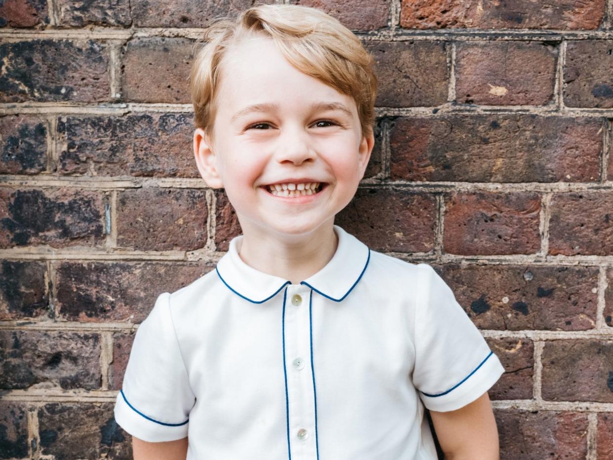 Prince George smiles in a picture released to mark his fifth birthday: PA