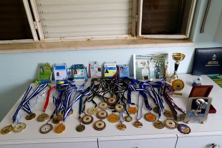 The winning medals of Palestinian swimmer Mary Al-Atrash, 22, who will represent Palestine at the 2016 Rio Olympics, are pictured at her house in Beit Sahour, near the West Bank town of Bethlehem, June 27, 2016. REUTERS/Ammar Awad