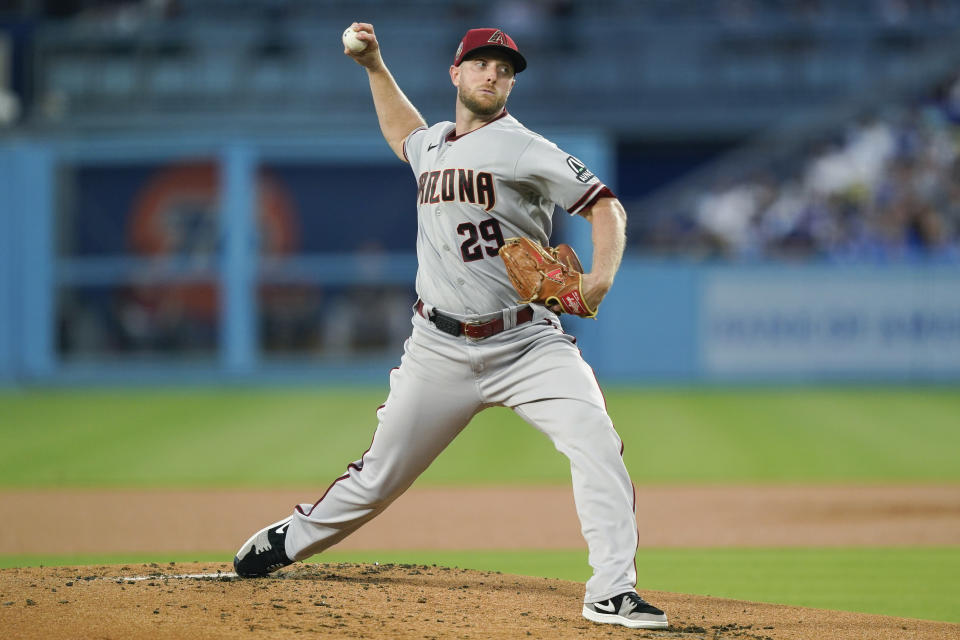 Arizona Diamondbacks starting pitcher Merrill Kelly throws to a Los Angeles Dodgers batter during the first inning of a baseball game Tuesday, Aug. 29, 2023, in Los Angeles. (AP Photo/Ryan Sun)