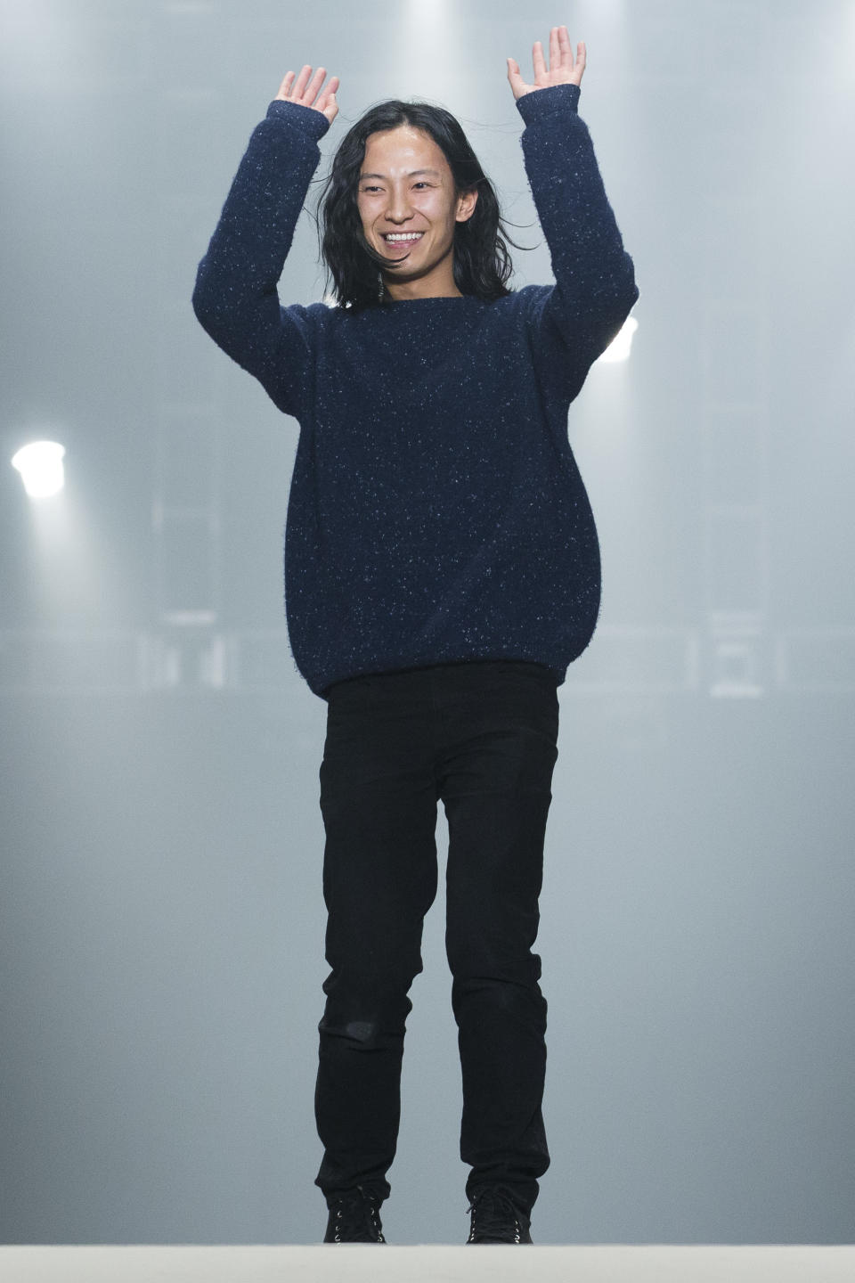 FILE - This Feb. 9, 2013 file photo shows designer Alexander Wang greeting the audience following his Fall 2013 fashion show during Fashion Week in New York. (AP Photo/John Minchillo, File)