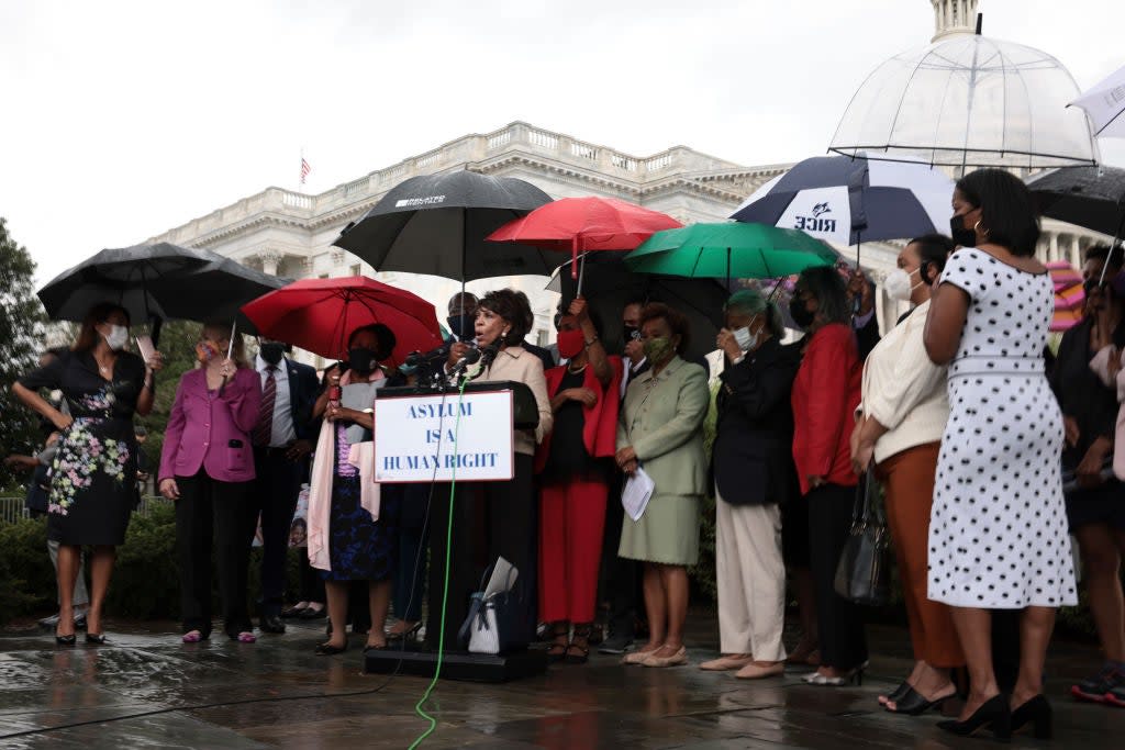 Rep Maxine Waters speaks during a news conference on the treatment of Haitian immigrants at the US border in Texas (Getty Images)