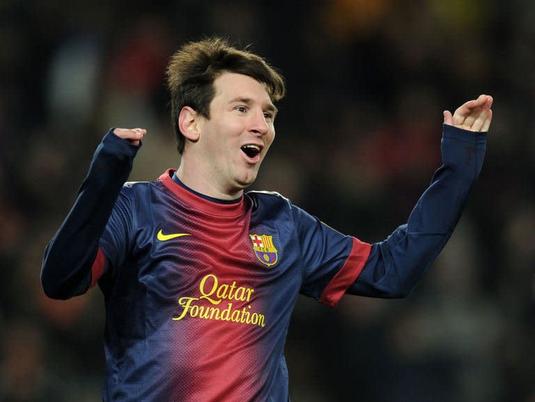 Barcelona's forward Lionel Messi celebrates after scoring during their Spanish league football match against Sevila at the Camp Nou stadium in Barcelona on February 23, 2013. Barcelona stretched their advantage at the top of La Liga to 15 points as two goals in eight minutes just before the hour mark from David Villa and Lionel Messi handed them a 2-1 win over Sevilla