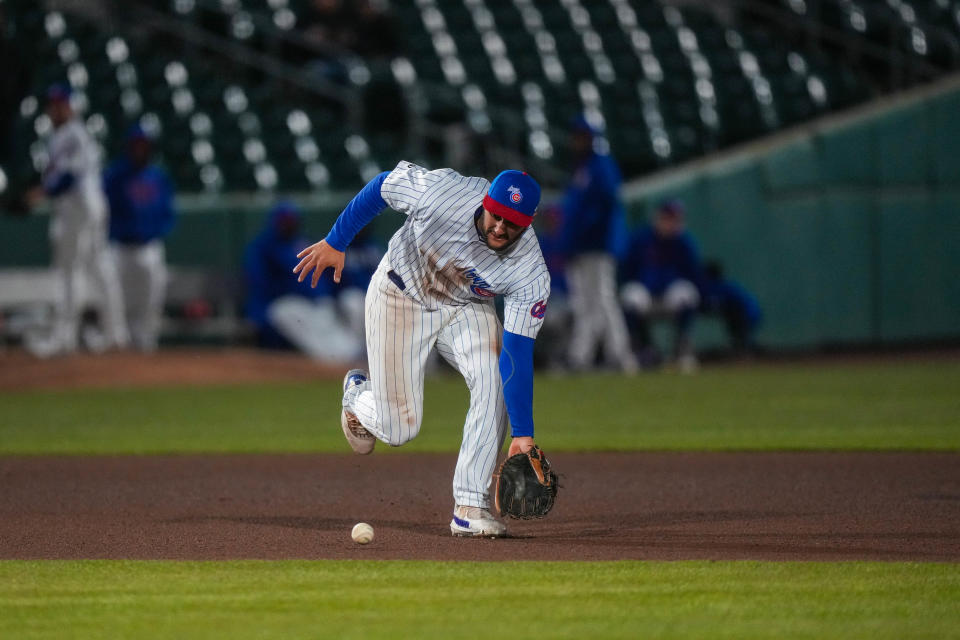 Iowa Cubs third baseman Jake Slaughter fields a ground ball during the season opener at Principal Park in Des Moines on March 31.