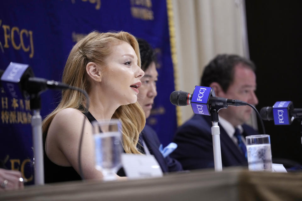 Tina Karol, left, Ukrainian singer and actress, Hiroshi Mikitani, center, CEO of Rakuten, Inc. and Sergiy Korsunsky, right, Ambassador of Ukraine to Japan, attend a press conference at the Foreign Correspondents' Club of Japan, Monday, May 16, 2022, in Tokyo. (AP Photo/Eugene Hoshiko)