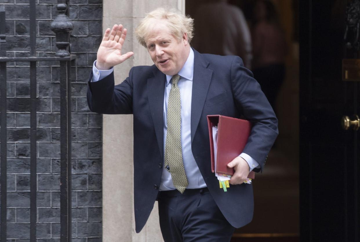 <span class="caption">U.K. Prime Minister Boris Johnson in mid-March, before he tested positive for the coronavirus.</span> <span class="attribution"><a class="link " href="https://www.gettyimages.com/detail/news-photo/file-photo-dated-on-march-18-2020-shows-british-prime-news-photo/1208351535" rel="nofollow noopener" target="_blank" data-ylk="slk:Ray Tang/Anadolu Agency via Getty Images;elm:context_link;itc:0;sec:content-canvas">Ray Tang/Anadolu Agency via Getty Images</a></span>