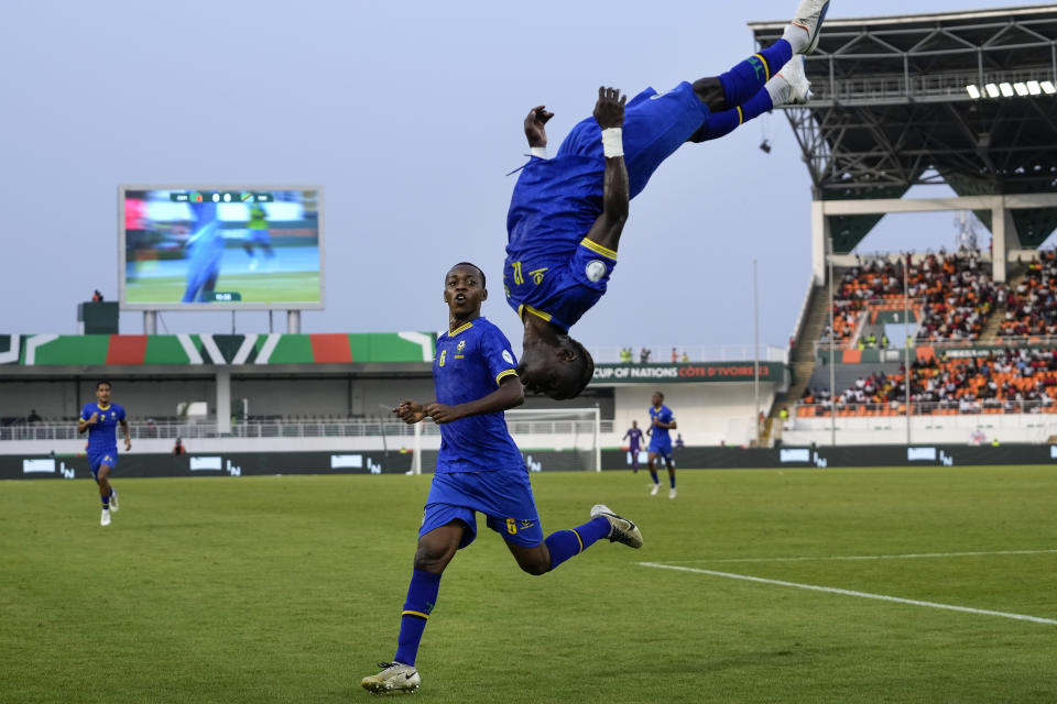 Tanzania's scorer Simon Msuva, right, jumps a somersault after he scored the opening goal during the African Cup of Nations Group F soccer match between Zambia and Tanzania, at the Laurent Pokou stadium in San Pedro, Ivory Coast, Sunday, Jan. 21, 2024. (AP Photo/Themba Hadebe)