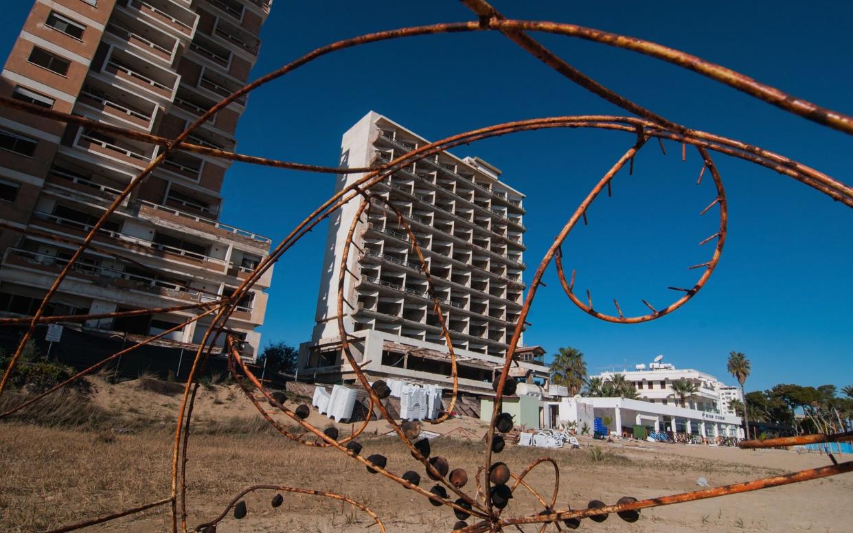 Barbed wire, the beach and the abandoned hotels of Varosha - Getty