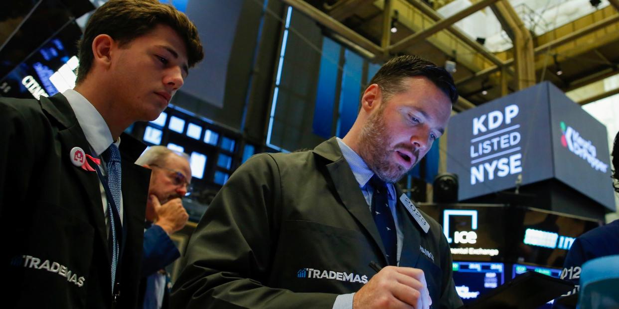 FILE PHOTO: Traders work on the floor at the New York Stock Exchange (NYSE) in New York, U.S., August 13, 2019. REUTERS/Eduardo Munoz