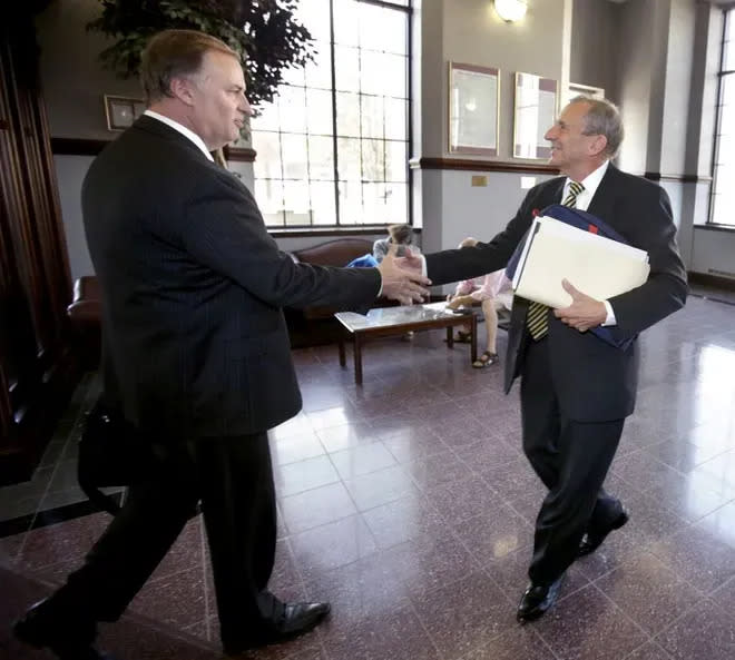 Then-Mayor WIlliam "Jamie" Healy II, left, greets Tom Bernabei inside The Repository in October 2015, prior to the mayoral election that year.