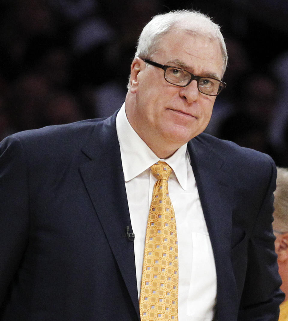 FILE - In this June 6, 2010 file photo, Los Angeles Lakers coach Phil Jackson watches during the first half of Game 2 of the NBA basketball finals against the Boston Celtics, in Los Angeles. Carmelo Anthony says he has heard that 11-time NBA champion coach Phil Jackson will be "coming on board" in a leadership capacity with the New York Knicks, though cautioned that nothing is yet official. Anthony made the comments Wednesday, March 12, 2014, to reporters in Boston, where the Knicks are playing the Celtics. (AP Photo/Chris Carlson, FILE)