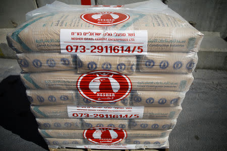 Bags of cement are seen ahead of their transfer to the southern Gaza Strip, inside the Kerem Shalom border crossing terminal between Israel and Gaza Strip January 16, 2018. REUTERS/Amir Cohen