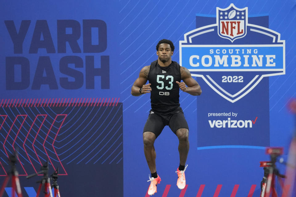 Michigan defensive back Dax Hill prepares to run the 40-yard dash at the NFL football scouting combine, Sunday, March 6, 2022, in Indianapolis. (AP Photo/Charlie Neibergall)