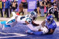 Dec 20, 2015; East Rutherford, NJ, USA; New York Giants wide receiver Odell Beckham Jr. (13) catches a touchdown pass in front of Carolina Panthers corner back Josh Norman (24) during the fourth quarter at MetLife Stadium. The Panthers defeated the Giants 38-35. Mandatory Credit: Brad Penner-USA TODAY Sports