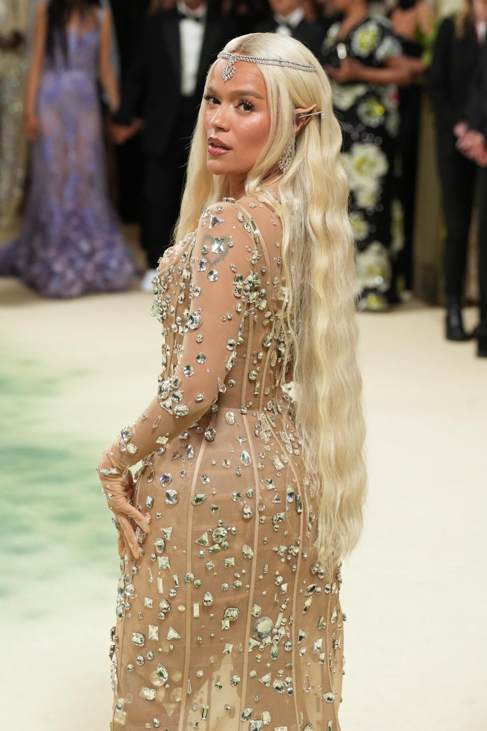The musician leaned into the whimsy of it all with her fairytale look, including prosthetic elf ears. Did someone say <a href="https://www.teenvogue.com/story/fairycore-trend-met-gala-2024-see-photos?mbid=synd_yahoo_rss" rel="nofollow noopener" target="_blank" data-ylk="slk:fairycore;elm:context_link;itc:0;sec:content-canvas" class="link ">fairycore</a>?