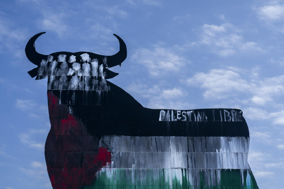 A Spanish fighting bull billboard, is painted with the colors of the Palestinian flag and a writing that reads "free Palestine", on the outskirts of Madrid, Tuesday, May 28, 2024. (AP Photo/Bernat Armangue)