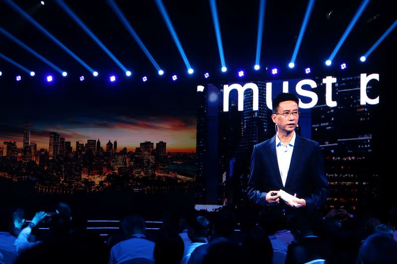 CEO of Ant Group Simon Hu is seen on a giant screen as he delivers a speech at the INCLUSION Fintech Conference in Shanghai