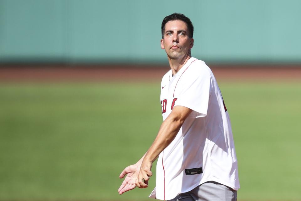 BOSTON, MA - AUGUST 12:  Assistant general manager Chris Snow of the Calgary Flames throws out a ceremonial first pitch before a game between the Boston Red Sox and the Tampa Bay Rays at Fenway Park on August 12, 2021 in Boston, Massachusetts.  (Photo by Adam Glanzman/Getty Images)