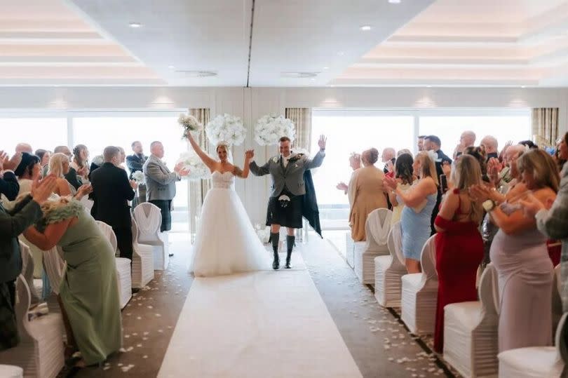 The newlyweds were not aware guests were watching the match during their wedding.