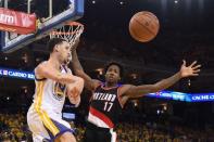 Golden State Warriors guard Klay Thompson (11) passes the basketball against Portland Trail Blazers center Ed Davis (17) during the third quarter in game two of the second round of the NBA Playoffs at Oracle Arena. The Warriors defeated the Trail Blazers 110-99. Mandatory Credit: Kyle Terada-USA TODAY Sports