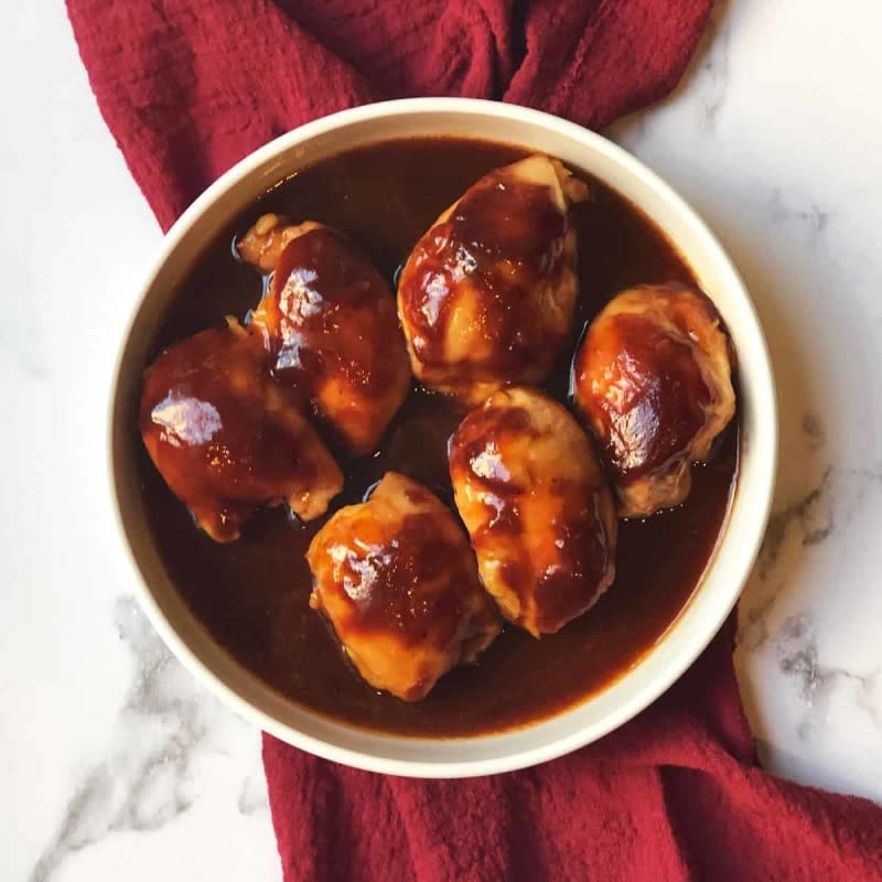 <p>Two Pink Peonies</p><p>Smother those chicken thighs with your favorite BBQ sauce and enjoy. </p><p><strong>Get the Recipe: <a href="https://www.twopinkpeonies.com/crockpot-bbq-chicken-thighs" rel="nofollow noopener" target="_blank" data-ylk="slk:Crockpot BBQ Chicken Thighs;elm:context_link;itc:0;sec:content-canvas" class="link ">Crockpot BBQ Chicken Thighs</a></strong></p>