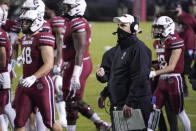 South Carolina interim coach Mike Bobo watches the stadium video screen during a timeout in the first half of the team's NCAA college football game against Georgia on Saturday, Nov. 28, 2020, in Columbia, S.C. Georgia won 45-16. (AP Photo/Sean Rayford)