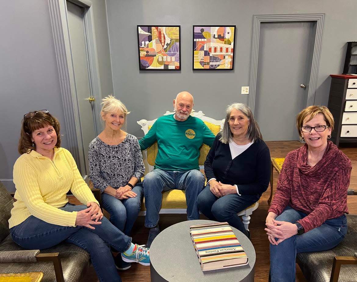 Resident artists of Market Street Art Spot are shown at the relocated and expanded gallery in downtown Minerva. A grand opening event and art show will be Friday. From left are Kim Anderson, Laura Donnelly, Marty Chapman, Michelle Mulligan and Therese Cook.