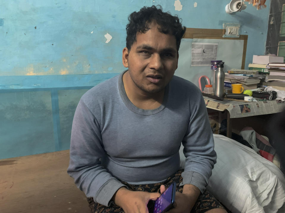 Suri Prakash, 25, a student in Jawaharlal Nehru University’s Sanskrit school, talks to the Associated Press in New Delhi, India, Monday, Jan. 6, 2020. Prakash who is blind said he was brutally beaten by masked assailants in his dormitory room late Sunday. The glass windows above the door were shattered and the latch opened from the outside. More than 20 people were injured in the attack opposition lawmakers are trying to link to the government. (AP Photo/Emily Schmall)