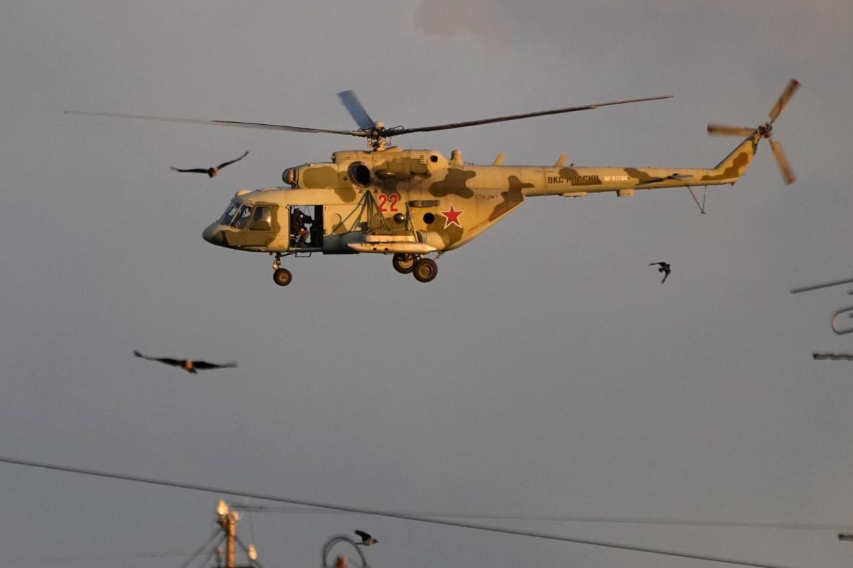 A Mi-8 military helicopter flies over St. Petersburg (AP)