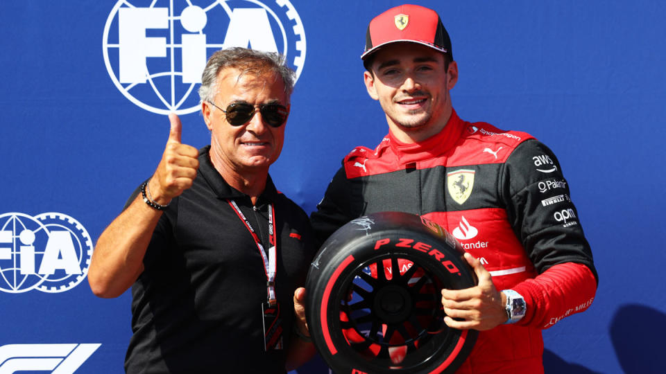 Jean Alesi (left), president of Circuit Paul Ricard and former Formula 1 driver, presents Ferrari's Charles Leclerc with the Pirelli Pole position trophy after the qualifying session of the 2023 French Grand Prix.
